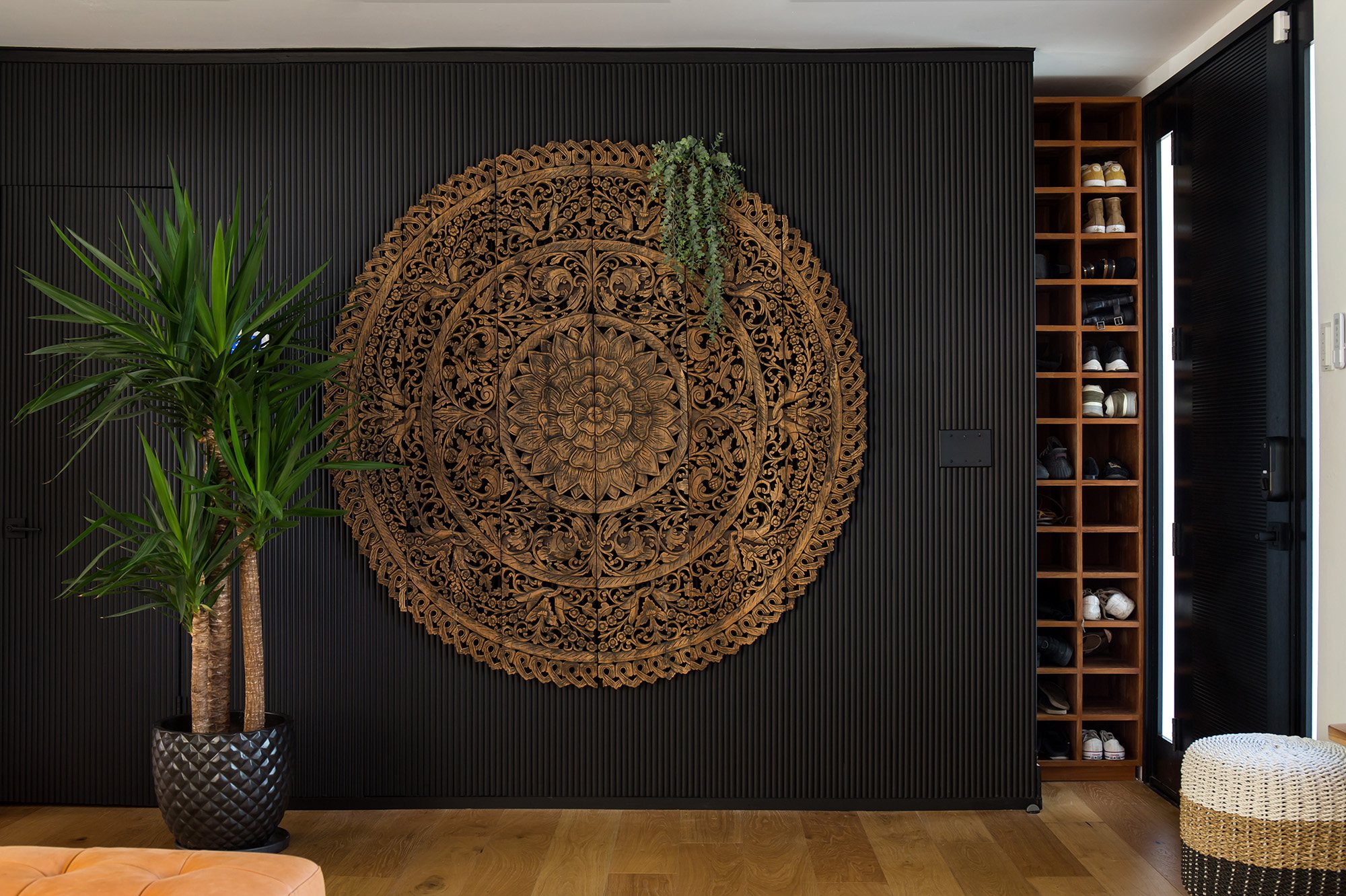 Carved mandala panel at Nimbali